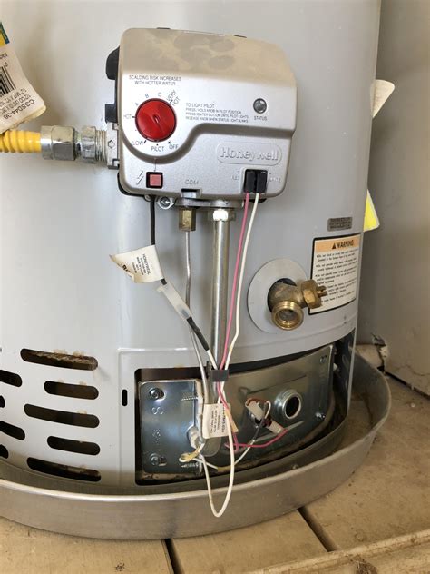 Remove the access panel to the burner section by removing the screws with a screwdriver. . Reset honeywell hot water heater